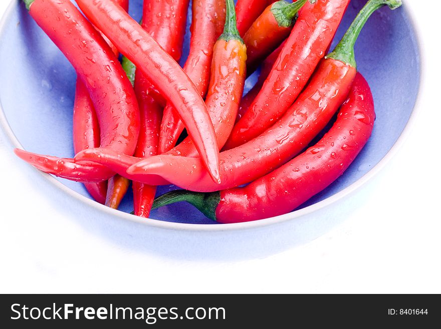 Red hot chili peppers in a blue bowl. Red hot chili peppers in a blue bowl