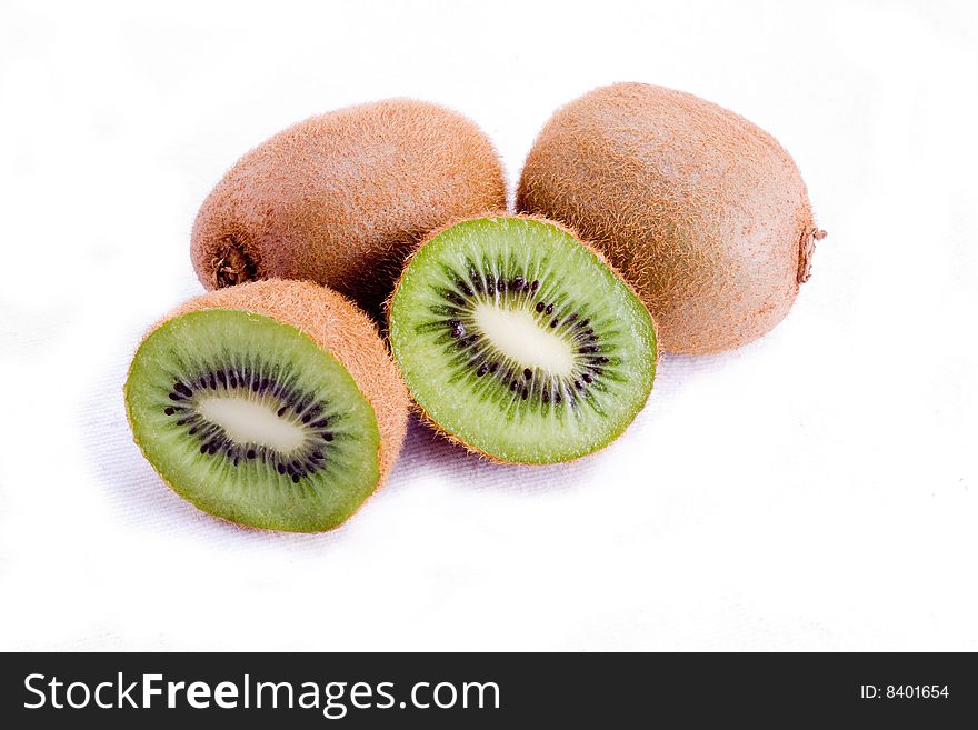 A halved kiwi fruit isolated on white