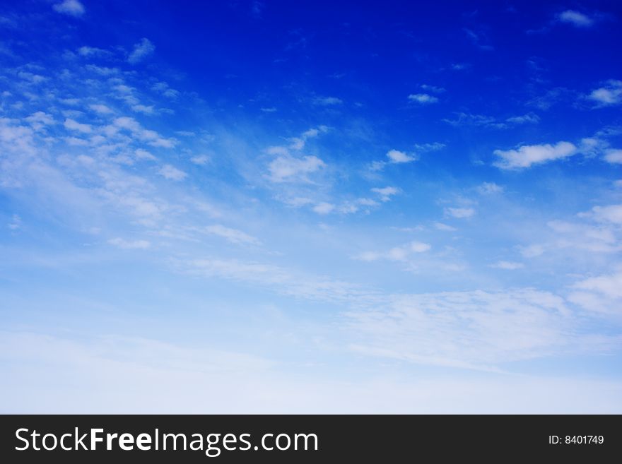 Aerial view of cloudy blue sky from aircraft window. Aerial view of cloudy blue sky from aircraft window.