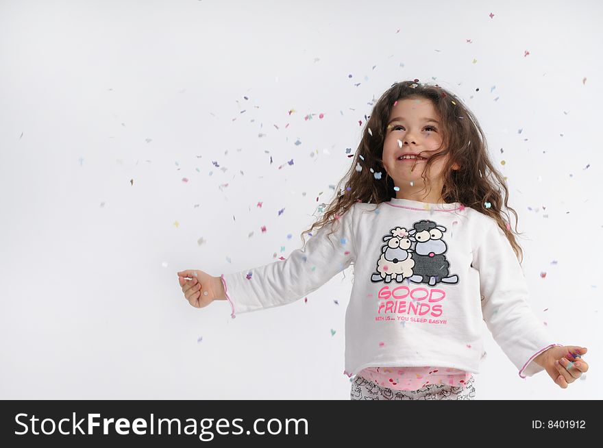 A child play with carnival confetti. A child play with carnival confetti