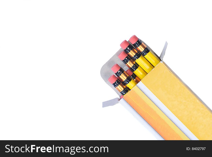 Box with brand new yellow pencils isolated on white