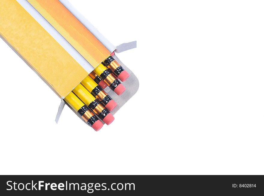 Box with brand new yellow pencils isolated on white