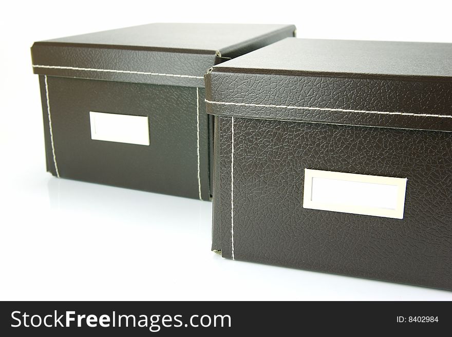 Brown stationery boxes isolated against a white background