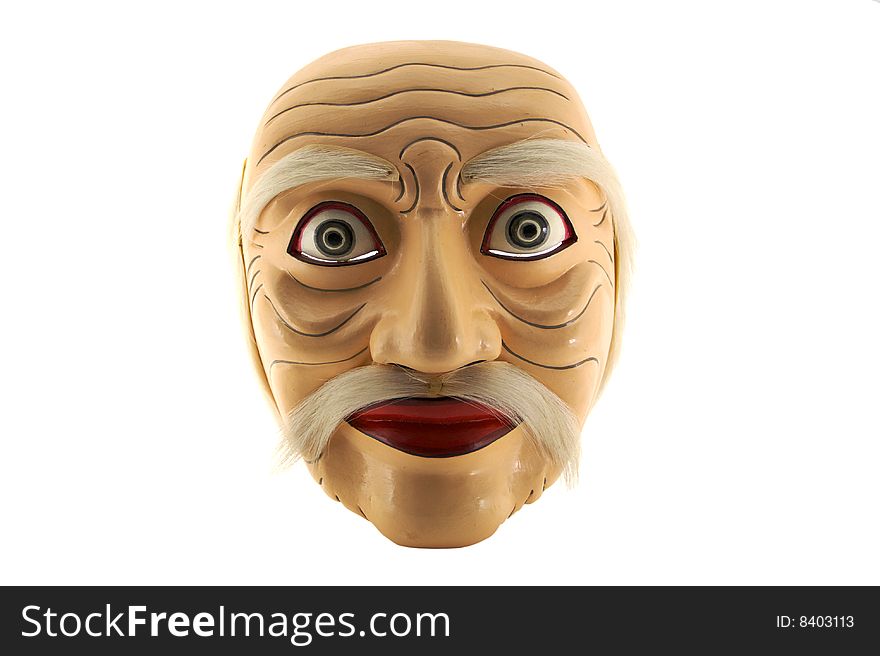 A Balinesian carved wood and painted face mask. A Balinesian carved wood and painted face mask