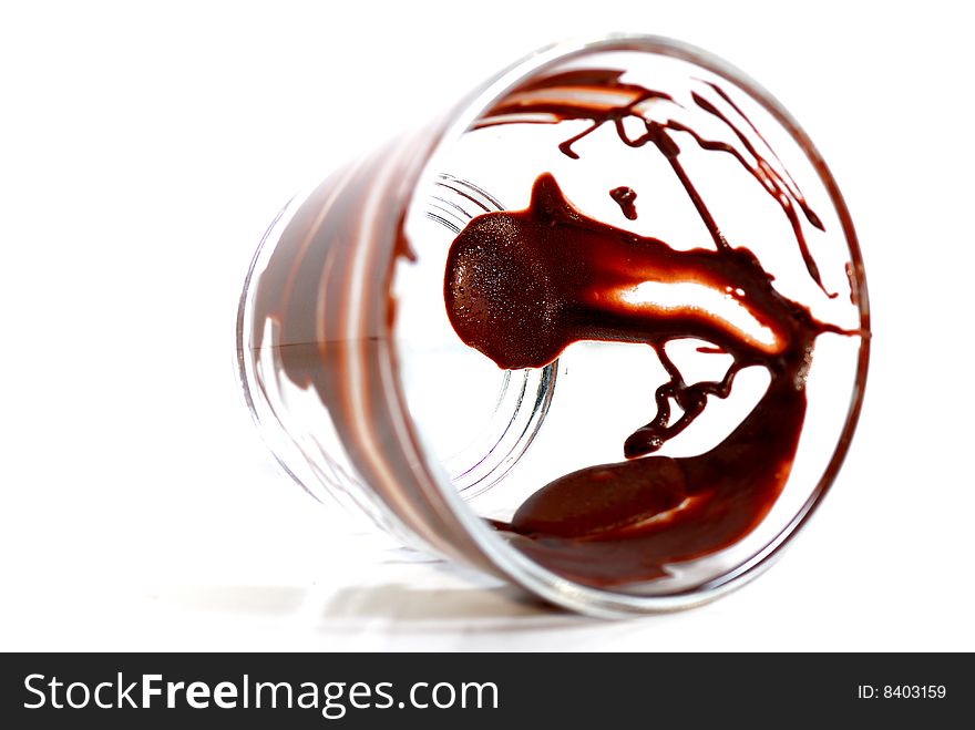 Melting Chocolate Drop in Transparent Cup. Melting Chocolate Drop in Transparent Cup