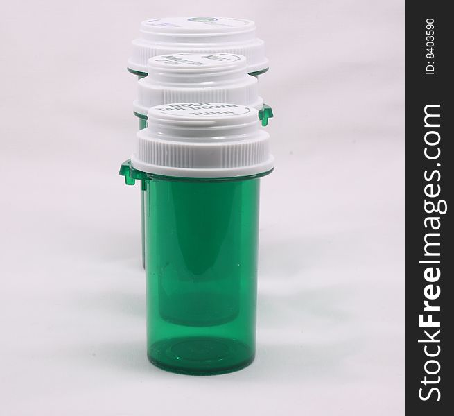 Three pill bottles isolated on a white background.