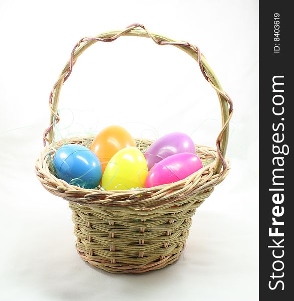 Easter eggs in basket on a white background.