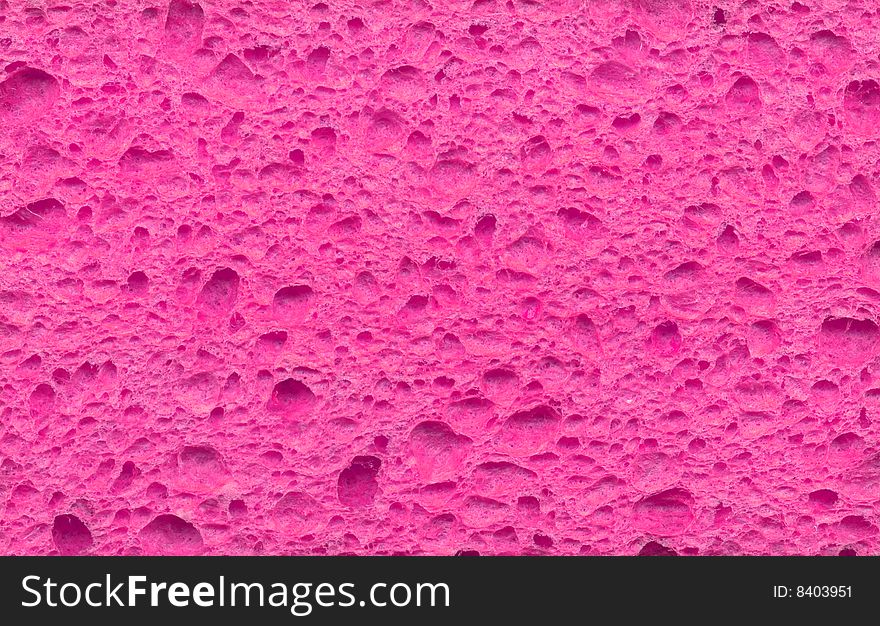 Scan of a pink sponge the kind used to scrub dishes in the kitchen sink