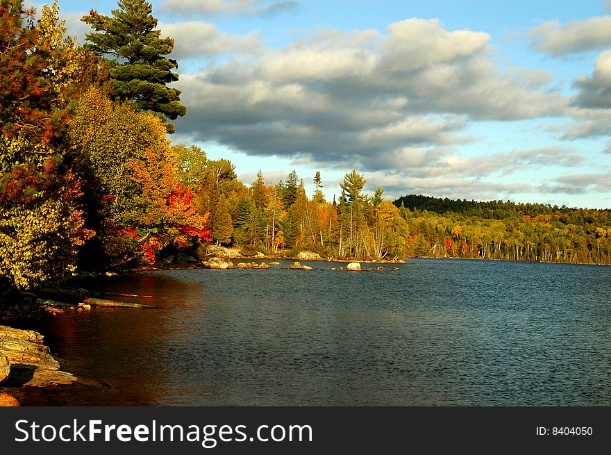 Fall comes to a bay on Flack Lake