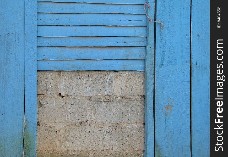 Blue exterior wall of an old building. Blue exterior wall of an old building