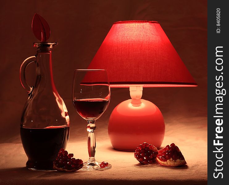 Red pomegranate wine and red lamp. Red pomegranate wine and red lamp.