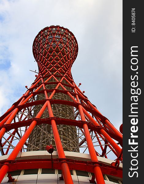 Day time view of the red port tower surrounded by blue sky near the harbor area in Kobe city, Japan. Day time view of the red port tower surrounded by blue sky near the harbor area in Kobe city, Japan