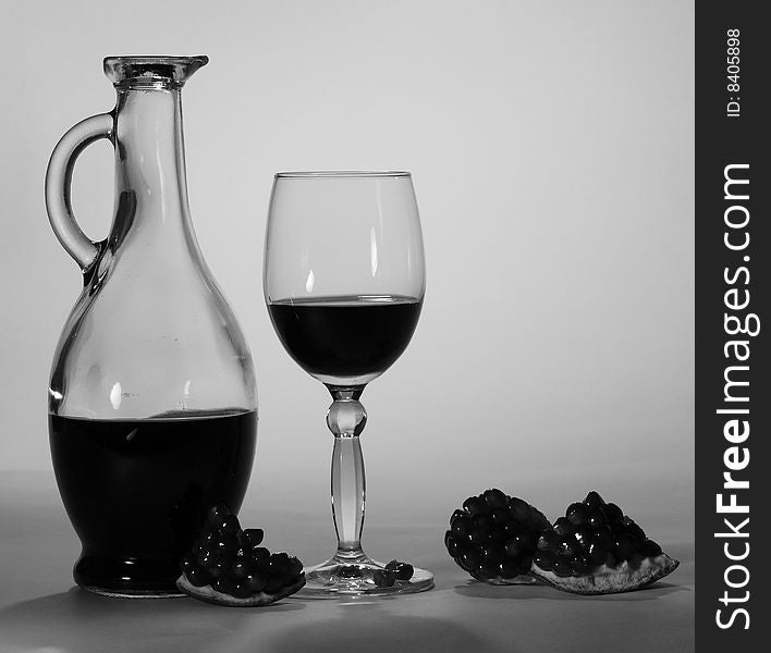 Red pomegranate wine. Black-and-white picture. Red pomegranate wine. Black-and-white picture.