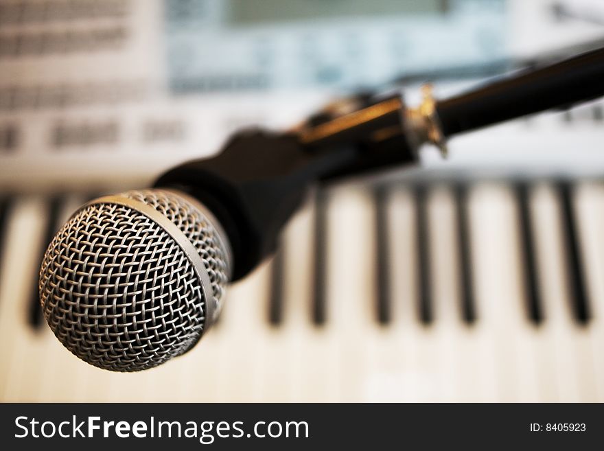 Stock photo: an image of a microphone and a keyboard. Stock photo: an image of a microphone and a keyboard