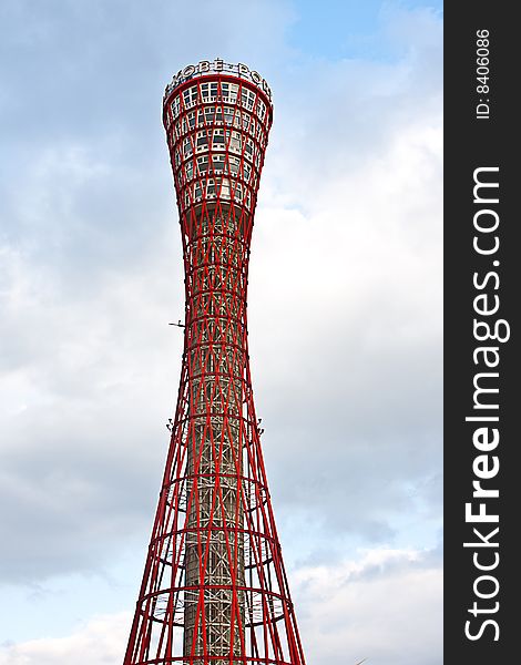 Day time view of the red port tower surrounded by blue sky near the harbor area in Kobe city, Japan. Day time view of the red port tower surrounded by blue sky near the harbor area in Kobe city, Japan