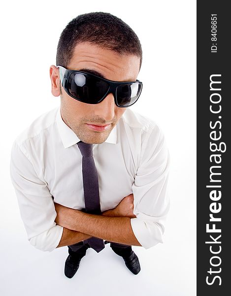 High angle view of young professional with sunglasses looking at camera against white background