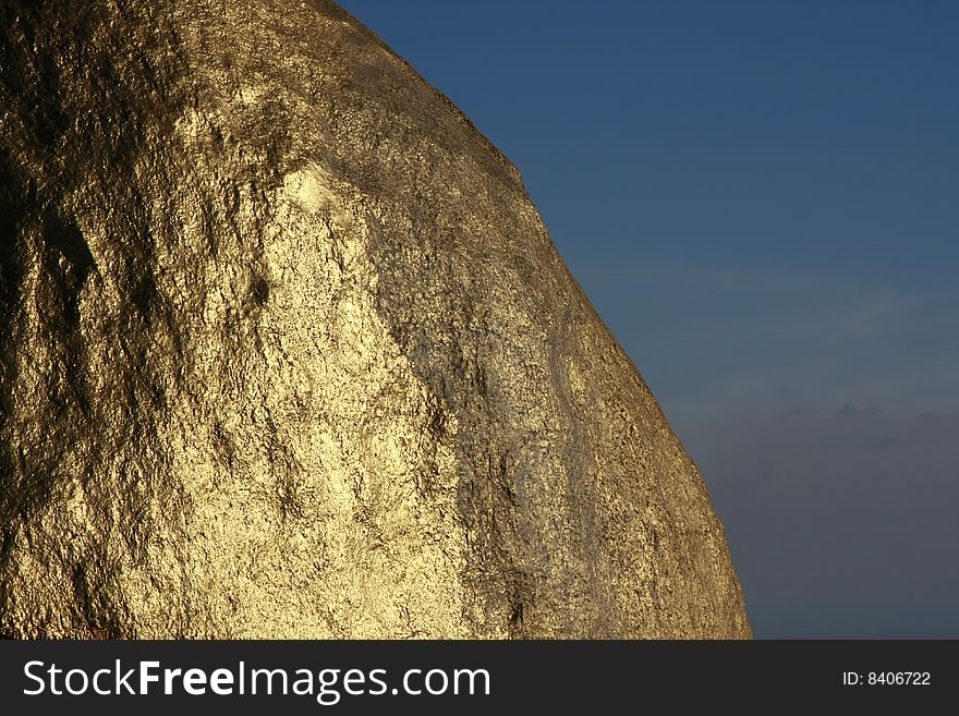 Texture of Kyaiktiyo Boulder Stupa (Golden Rock), Mon State, Myanmar (Burma).