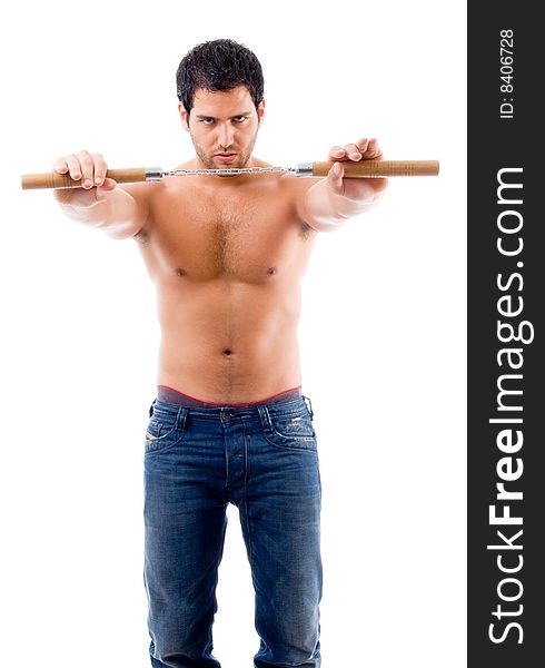 Standing strong man holding nunchaku with white background