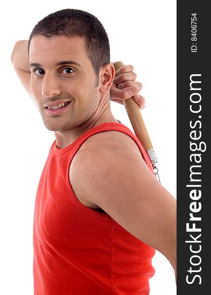 Handsome male with nunchaku against white background