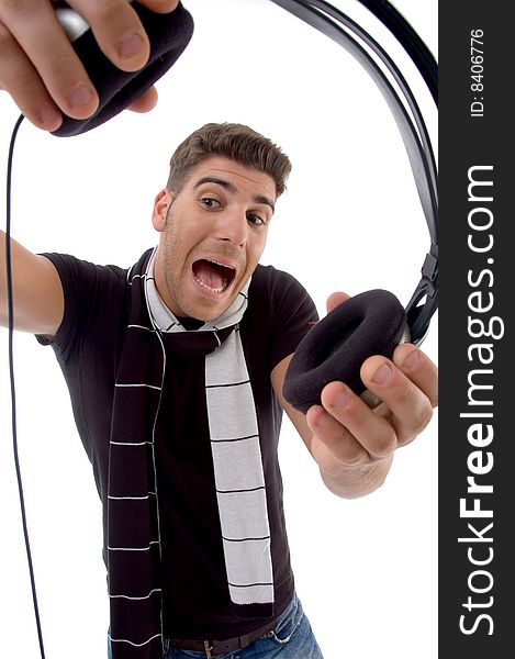 Shouting male holding headphone on an isolated white background