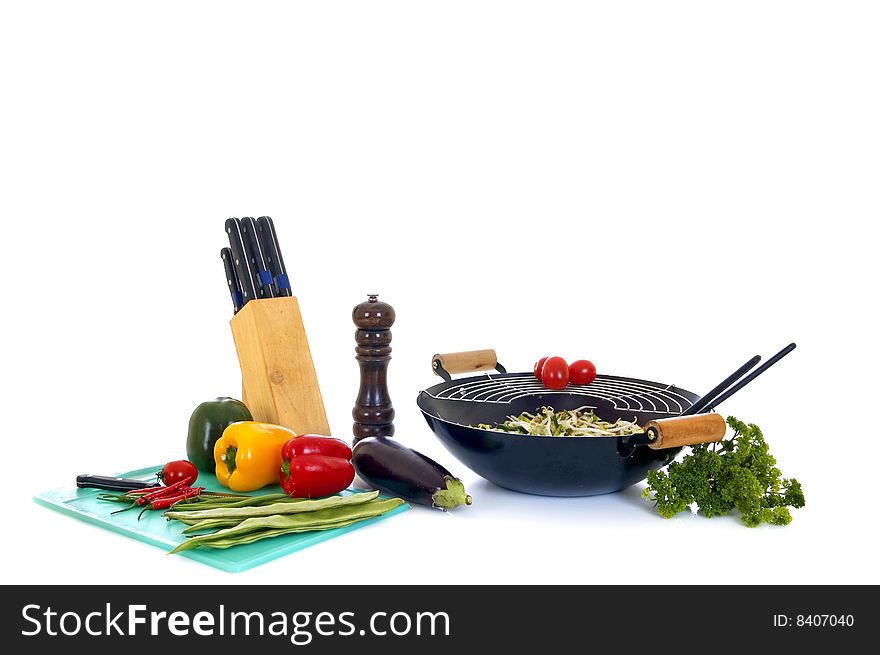 Preparing wok with fresh vegetables on cutting-board, white background,