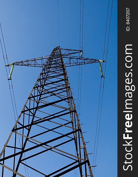 Power Line Poles Over Blue Sky Background