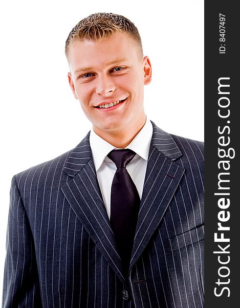 Portrait of smiling young businessman against white background