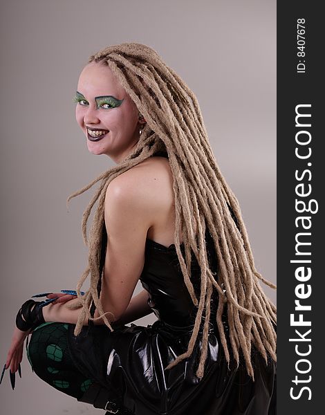 Young woman with dread locks and punk clothing. Young woman with dread locks and punk clothing