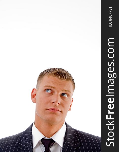 Handsome executive looking upward on an isolated white background
