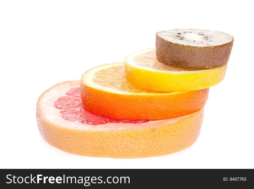 Assorted fruits of orange, grapefruit, kiwi and lemon on a white background