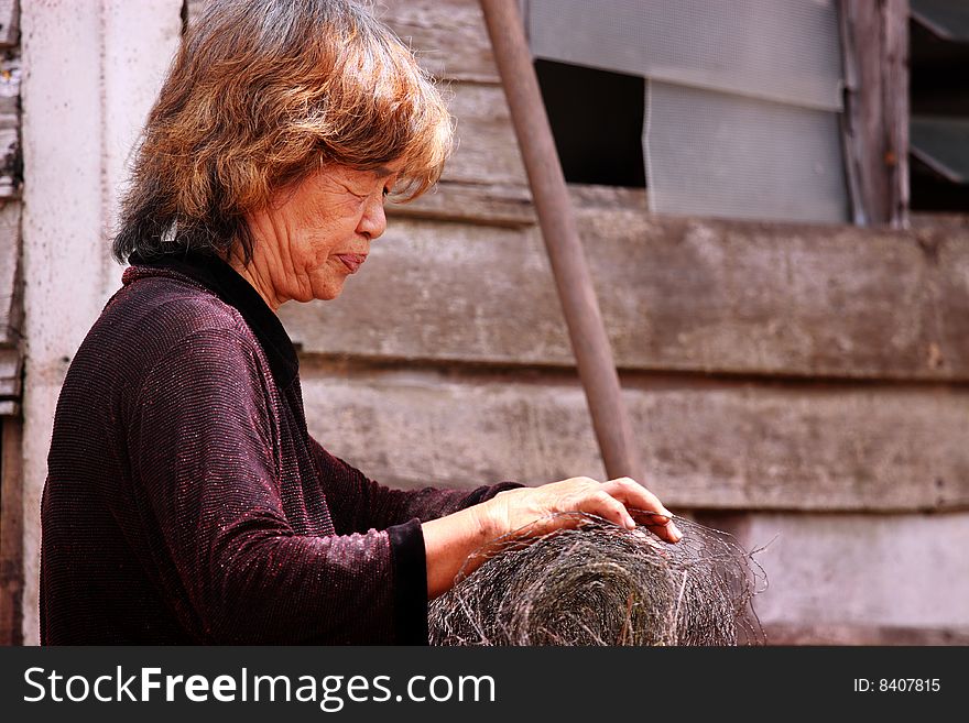 Old female worker at a re-construction site. Old female worker at a re-construction site