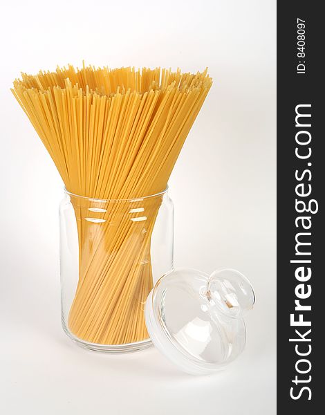 Spaghetti in bowl on white background