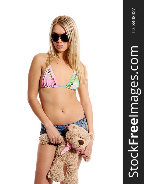 Young beautiful blond  girl on white background with teddy-bear.