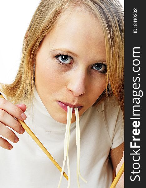 Blond woman use chopsticks eating noodles