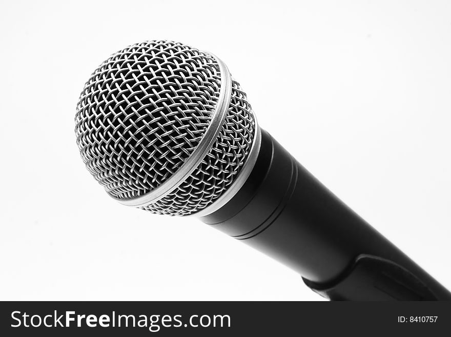 A chromed black microphone isolated on white background