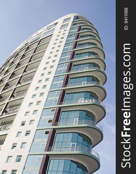 Modern office building on a background of blue sky