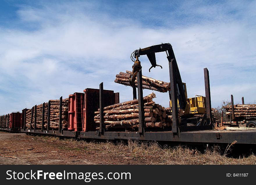 Loading Logs on a Railcar