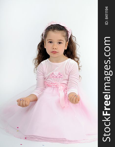 A little girl dressed as a pink princess. A little girl dressed as a pink princess