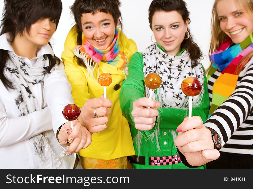 Group of attractive girls holding lollipops in hands. Group of attractive girls holding lollipops in hands