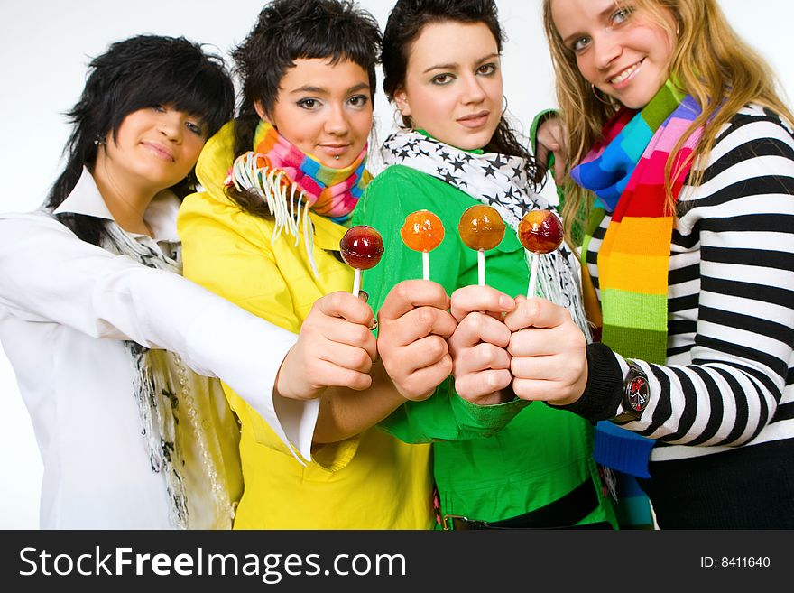 Group of attractive girls holding lollipops in hands. Group of attractive girls holding lollipops in hands