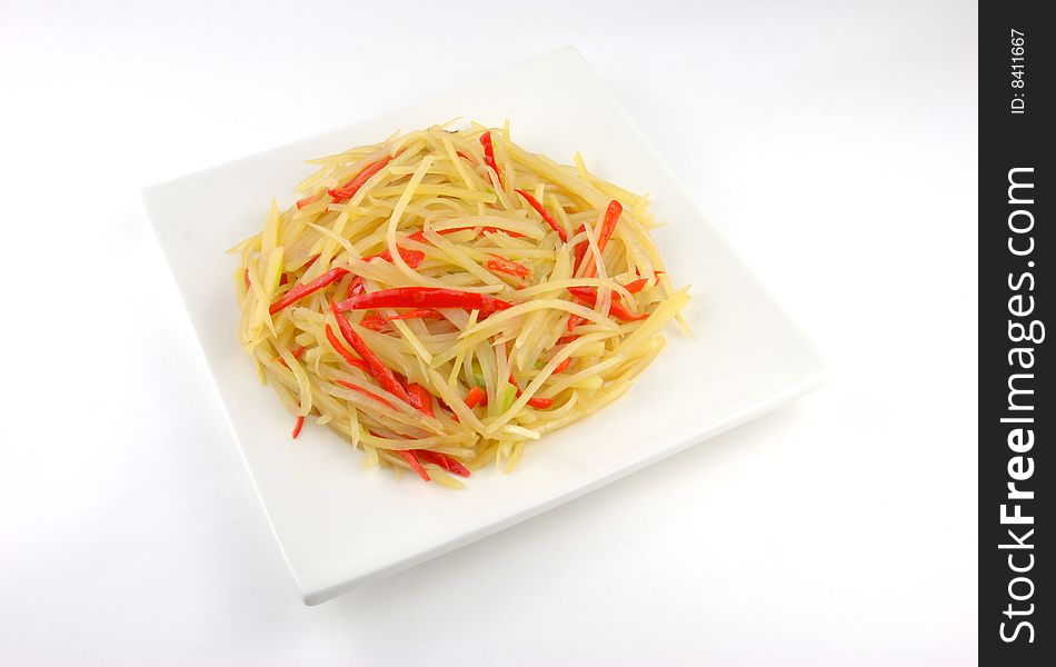 Plate of fried potato isolated on white