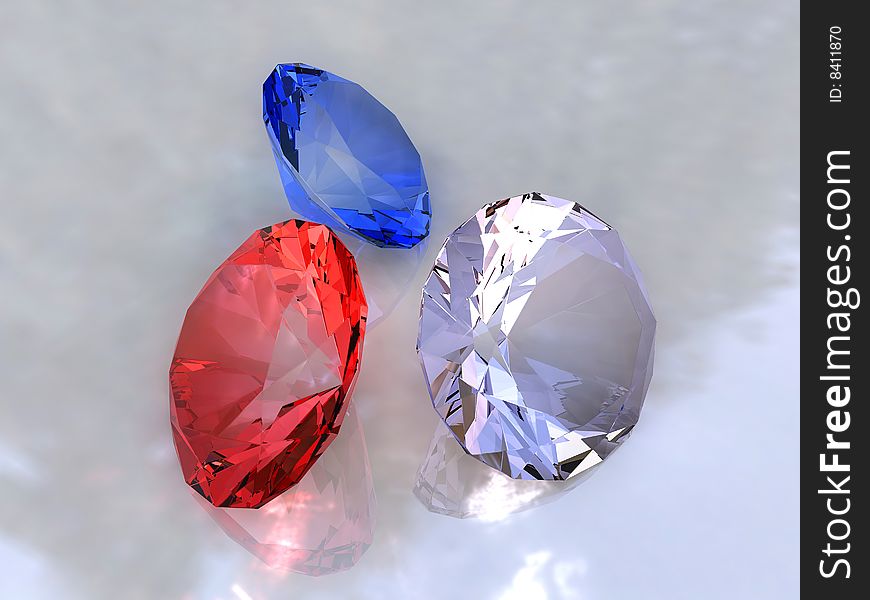 Three colour crystals on a white background with patches of light