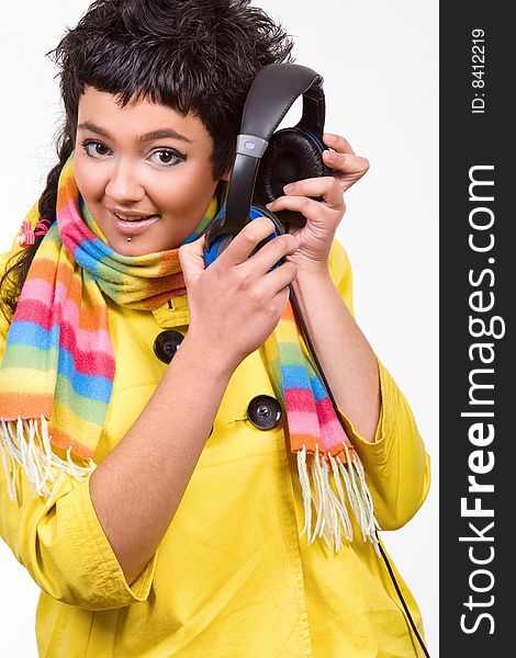 Attractive young woman with headphones over white background