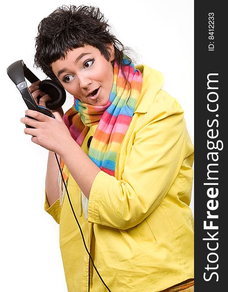 Attractive young woman with headphones over white