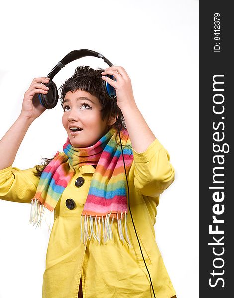 Attractive young woman with headphones over white