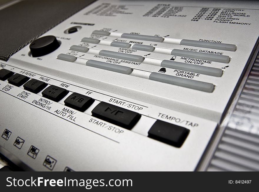 Selection buttons for different functions on a musical keyboard. Selection buttons for different functions on a musical keyboard.