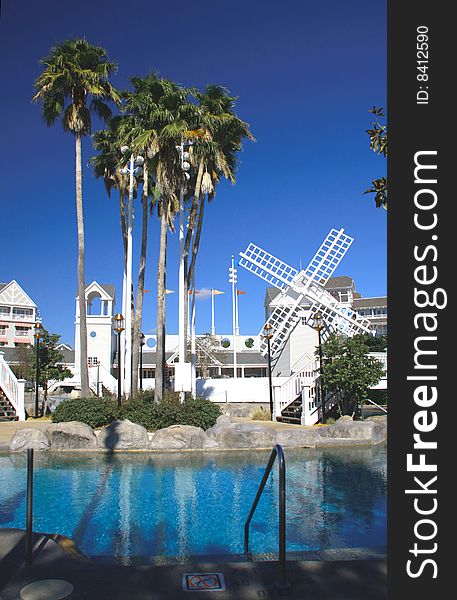 Recreational Resort Poolside With White Windmill