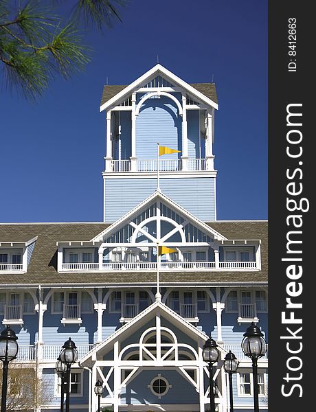 Balcony terrace and tower siding house with yellow flags