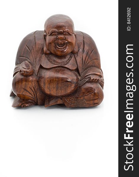 Smiling wooden buddha isolated on a white background