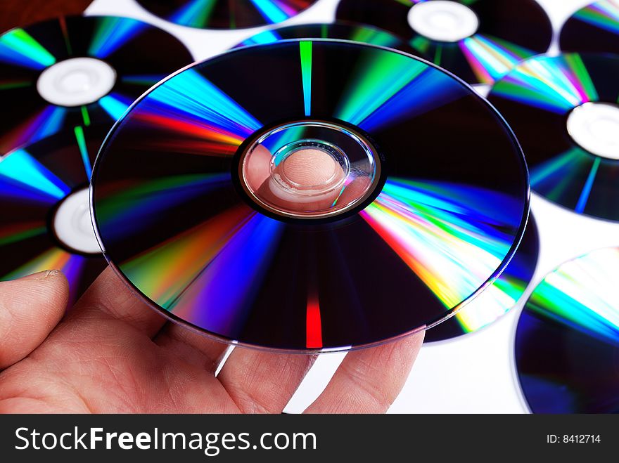 Closeup of compact disc hold in man's hand